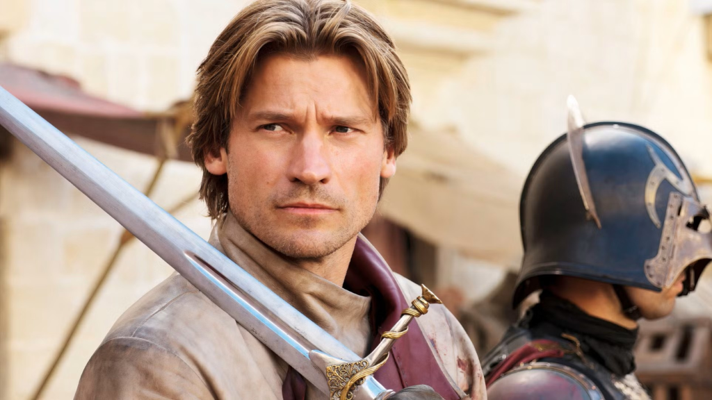 Nikolaj Coster-Waldau sebagai Jaime Lannister yang memegang pedang dalam Game of Thrones