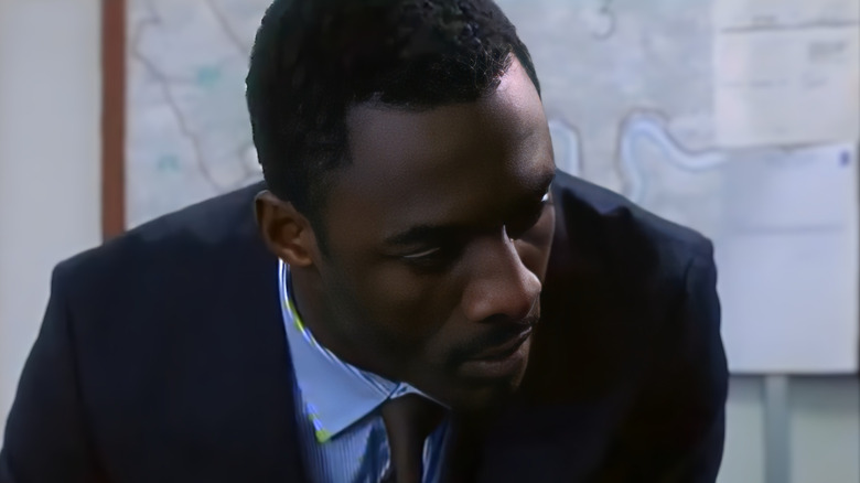 Vaughan (Idris Elba) leaning over in Ultraviolet